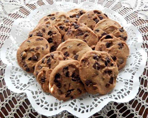 Homemade chocolate chip cookies on lace tablecloth