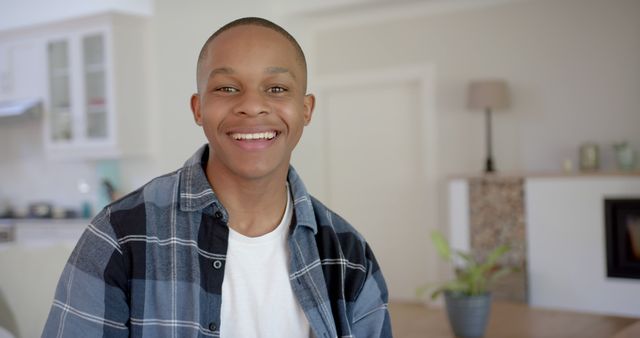 Smiling Young Man Relaxing at Home in Casual Wear - Download Free Stock Images Pikwizard.com