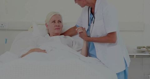 Nurse Provides Compassionate Care to Elderly Patient in Hospital