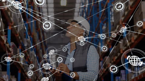 Supervisor Oversees Warehouse with Digital Global Networking Interface
