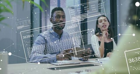 Team Analyzing Digital Data Insights in Active Meeting