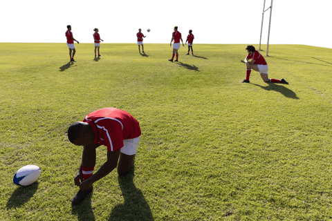 Diverse rugby team preparing on transparent field background