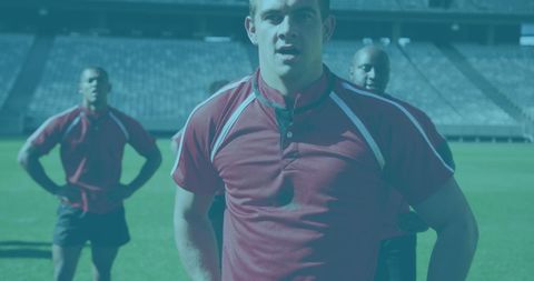 Rugby Players in Unison on Sunny Stadium Field