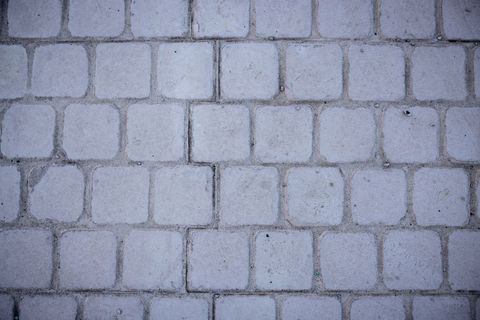 Cobblestone street surface of square stones