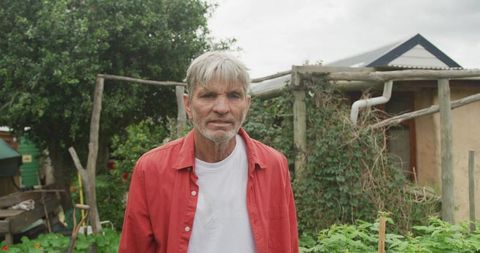 Senior Man Enjoying Gardening in Outdoor Organic Farm