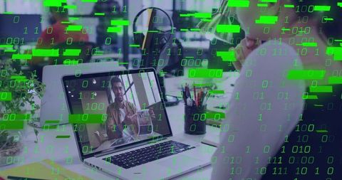 Blonde professional watching remote presentation on laptop with green binary code overlay