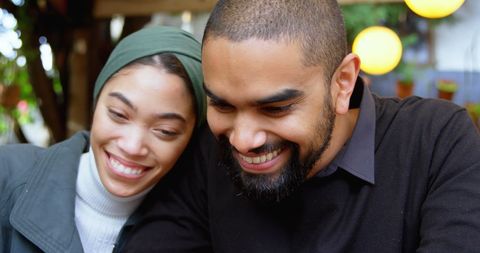 Happy Couple Enjoying Time at Cafeteria Together