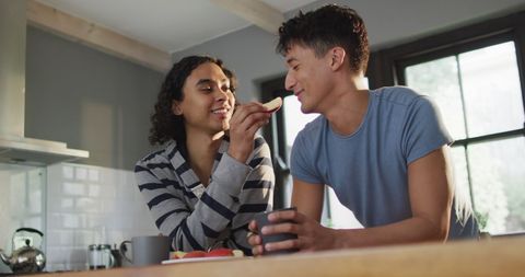 Happy Diverse Male Couple Enjoying Breakfast at Home