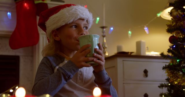 Child Sipping Hot Chocolate During Christmas Celebration - Download Free Stock Images Pikwizard.com