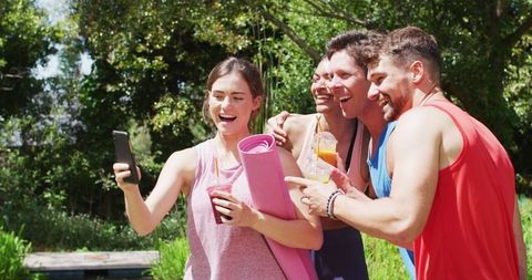 Group of Friends Enjoying Post-Yoga Together in Park