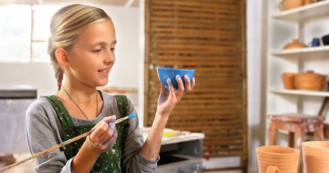 Young Girl Painting Pottery in Art Workshop - Download Free Stock Images Pikwizard.com