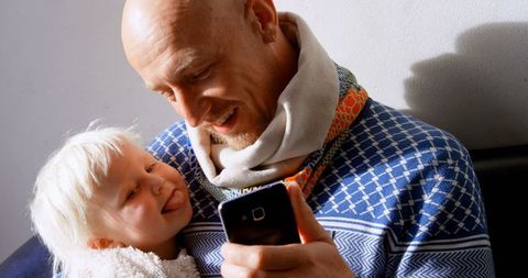 Father and Son Taking Selfie Together Joyfully