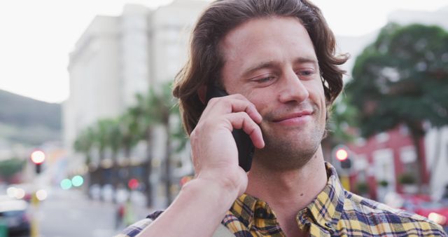 Smiling Young Man Talking on Cell Phone Outdoors on City Street - Download Free Stock Images Pikwizard.com