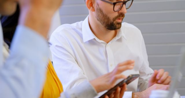 Bearded Man Wearing Glasses Using Digital Tablet in Office - Download Free Stock Images Pikwizard.com