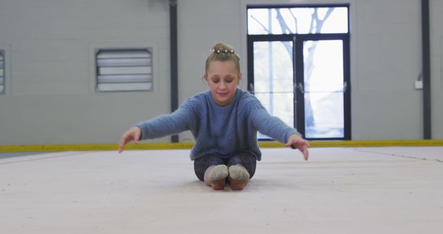 Young Girl Practicing Gymnastics Inside Gym Hall - Download Free Stock Images Pikwizard.com