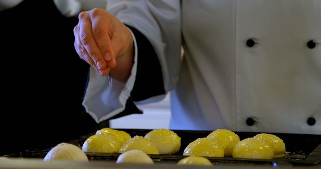 Pastry Chef Sprinkling Sugar on Dough Balls in Kitchen - Download Free Stock Images Pikwizard.com