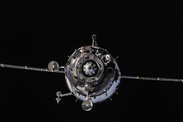 The Soyuz TMA-10M spacecraft carrying Expedition 37 members approaches the International Space Station (ISS). This image illustrates advanced space technology and international collaboration. Excellent for educational resources, presentations on space missions, and articles on space travel and exploration.