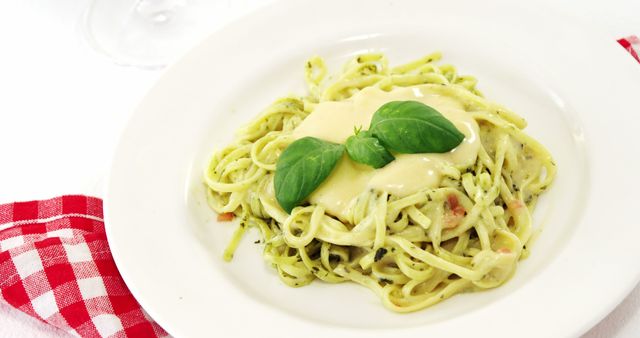 Delicious Creamy Basil Pesto Pasta with Cheese Garnish - Download Free Stock Images Pikwizard.com