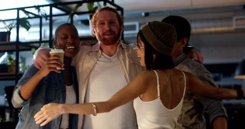 Diverse Colleagues Celebrating Teamwork Success in Modern Office