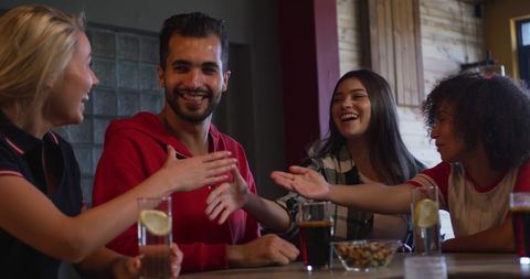 Diverse Group of Friends Celebrating at a Bar - Download Free Stock Images Pikwizard.com