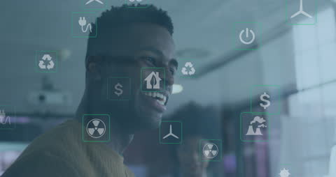 Diverse Coworkers Engaging with Interactive Environmental Technology