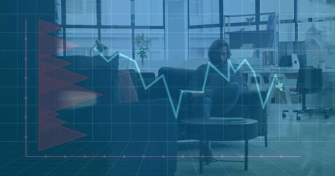 Man Studying Financial Data on Tablet in Office Lounge with Analytics Overlay