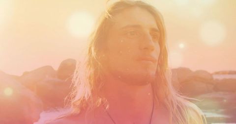 Contemplative Beach Walk with Ethereal Sunset Atmosphere