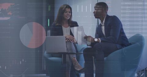 Business Professionals Analyzing Financial Data Using Technology