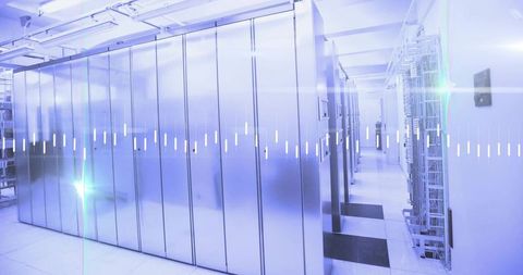 Shimmering server racks lining aisle in data center with led status lights, cooling