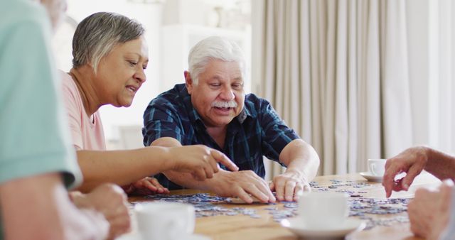 Seniors Assembling Puzzle Together in Social Setting - Download Free Stock Images Pikwizard.com