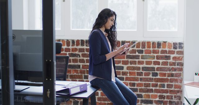 Professional Woman Working on Tablet in Modern Office - Download Free Stock Images Pikwizard.com