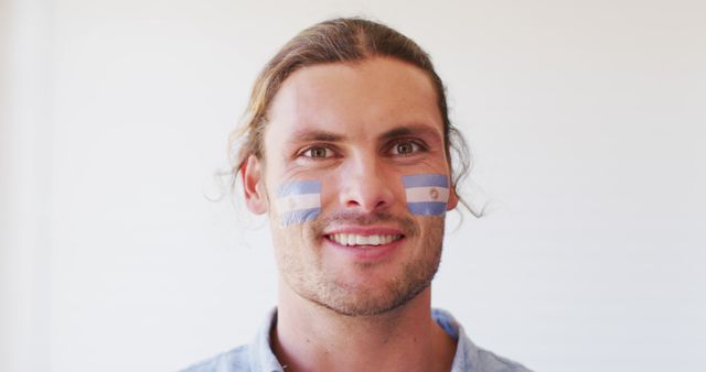 Cheerful Man with Argentina National Flag on Face - Download Free Stock Images Pikwizard.com