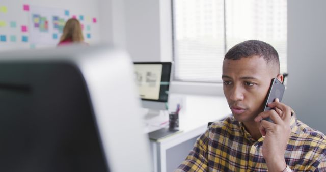 Young Professional Man on Phone Call in Bright Office - Download Free Stock Images Pikwizard.com