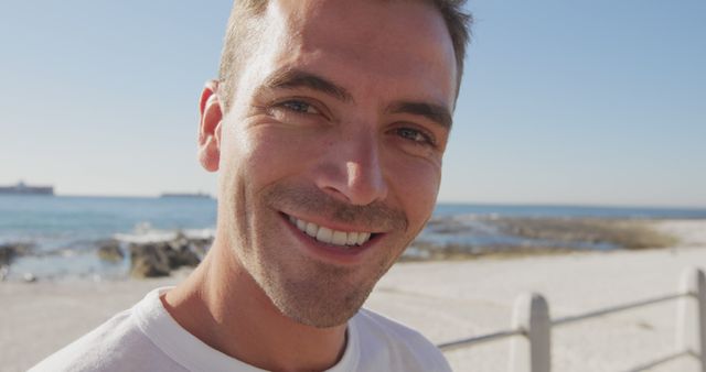 Cheerful Young Man Enjoying Sunny Day at Beach - Download Free Stock Images Pikwizard.com