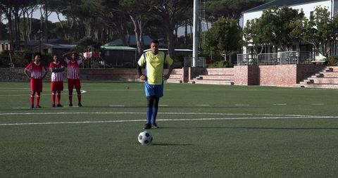 Focused Soccer Player Preparing for Free Kick