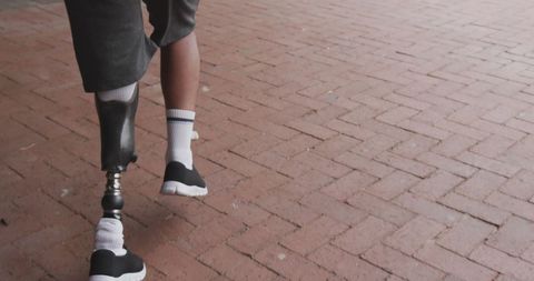 Inspirational Journey of Man with Prosthetic Leg on Brick Path - Download Free Stock Images Pikwizard.com