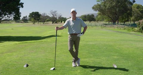 Golfer Relaxing on Sunny Day at Scenic Course - Download Free Stock Images Pikwizard.com