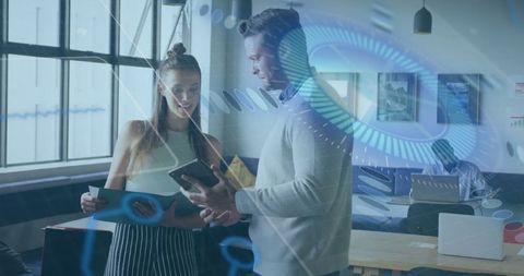 Collaborative office team analyzing digital data with technology