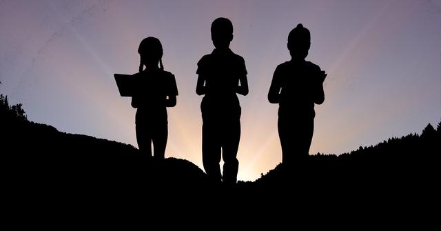Digital composite of Silhouette children studying on mountain during sunset