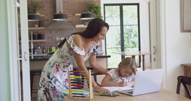 Happy Caucasian Mother Helping Daughter with Homework on Laptop at Home - Download Free Stock Images Pikwizard.com