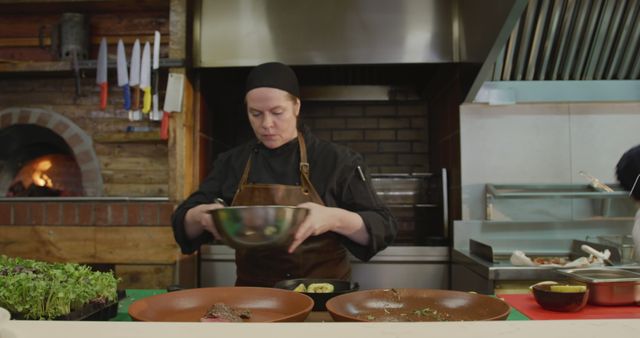 Professional Chef Preparing Meal in Rustic Restaurant Kitchen - Download Free Stock Images Pikwizard.com