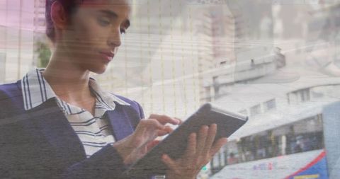 caucasian businesswoman using tablet with blurred urban movement - Download Free Stock Images Pikwizard.com