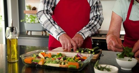 Senior Couple Preparing Healthy Meal in Modern Kitchen