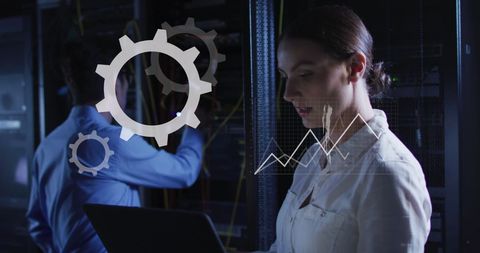 Caucasian Woman Analyzing Data in Modern Server Room - Download Free Stock Images Pikwizard.com