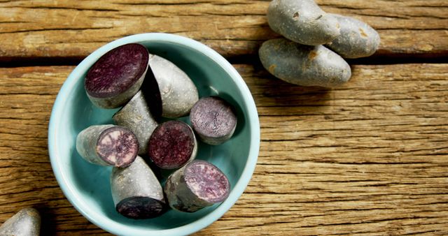 Purple Sweet Potatoes in Blue Bowl on Rustic Wooden Table - Download Free Stock Images Pikwizard.com