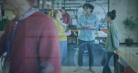 Diverse startup team chatting in coworking space with futuristic HUD data overlays