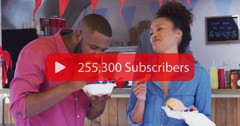 Social network milestone celebrated by joyful couple in cafe