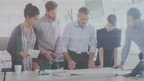 Executives Collaborating on Business Strategies with Data Visualizations