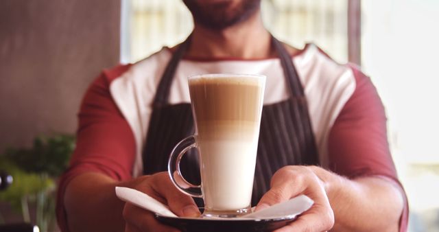 Barista Serving Freshly Made Latte in Cafe - Download Free Stock Images Pikwizard.com