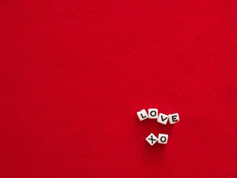 Love Message Dice on Red Background
